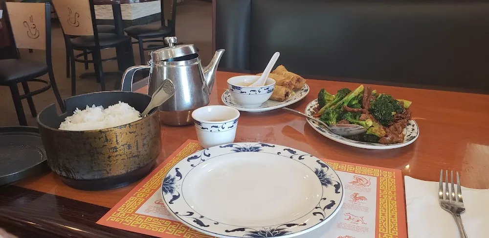 Broccoli Beef Steamed Rice Egg Rolls Egg Flower Soup and Tea